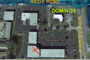 Parking lot overhead showing Dominos and our building with the red X.